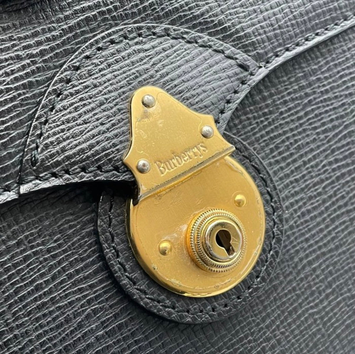 Burberrys Vintage Textured Leather Lock Clutch Bag
